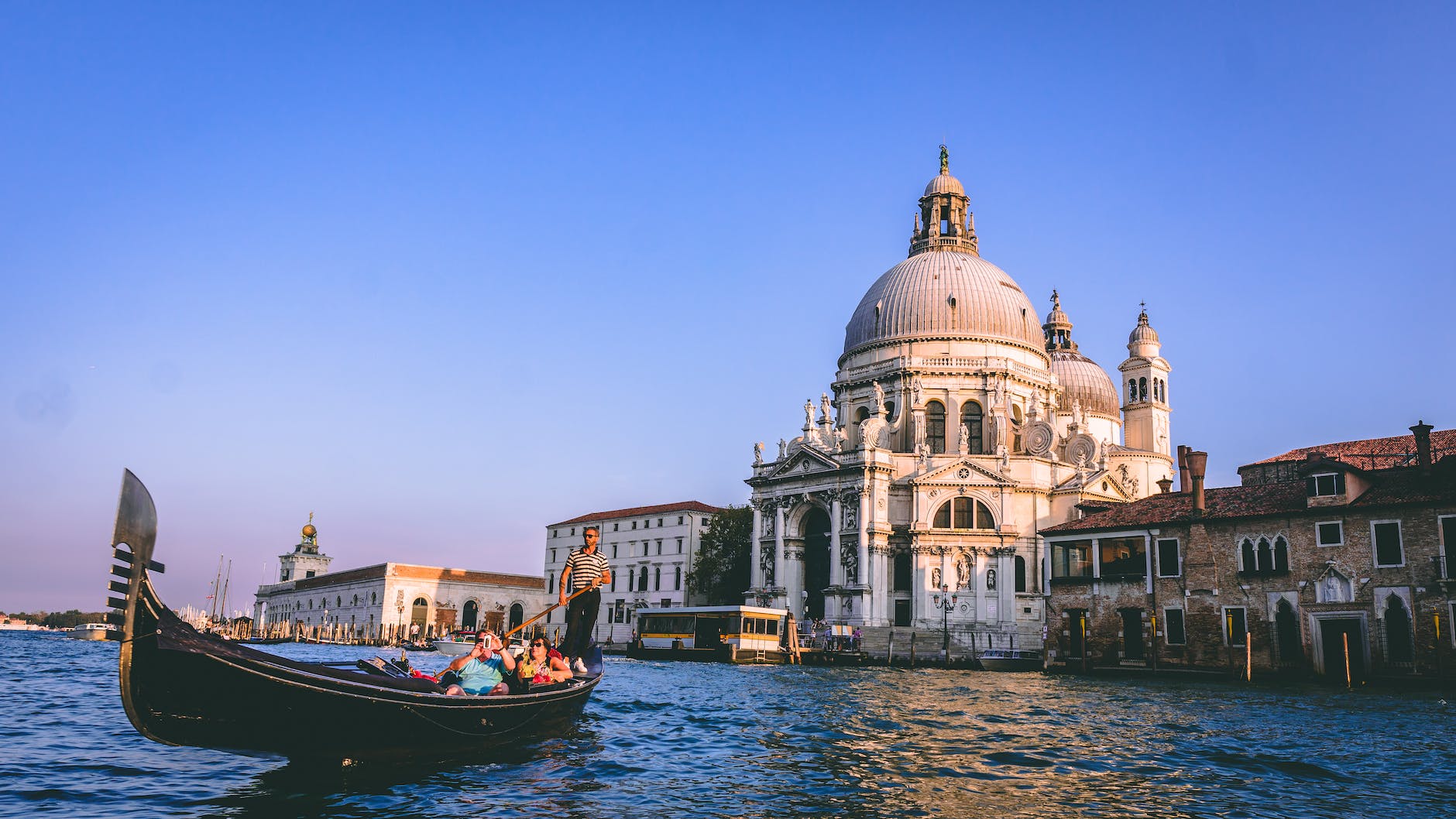 people on a gondola in venice