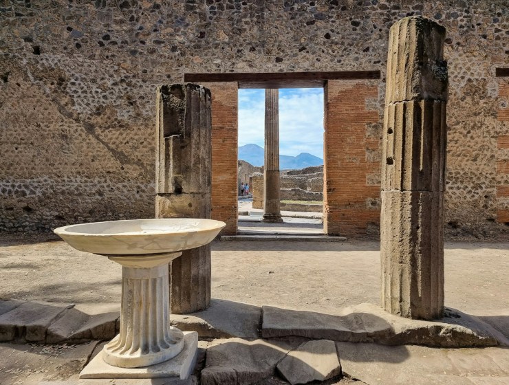 Pompeii stone building with a round table