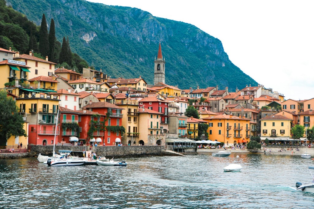 brown and white concrete buildings near body of water during daytime