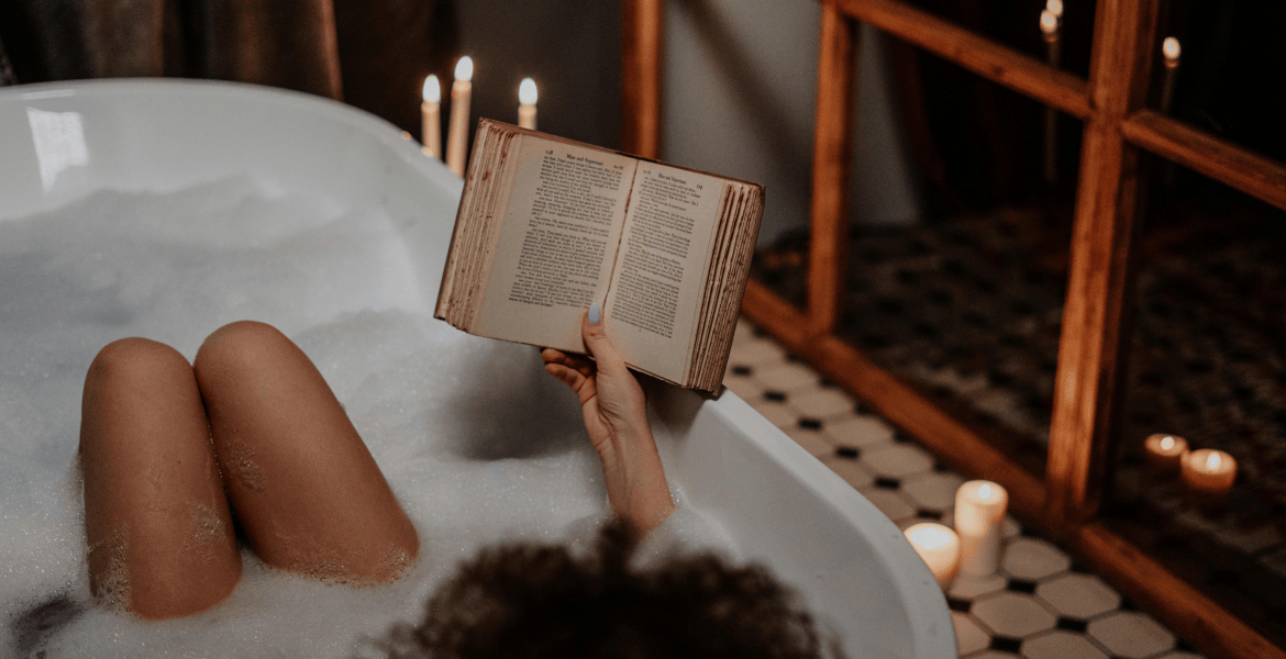 woman reading in bathtub
