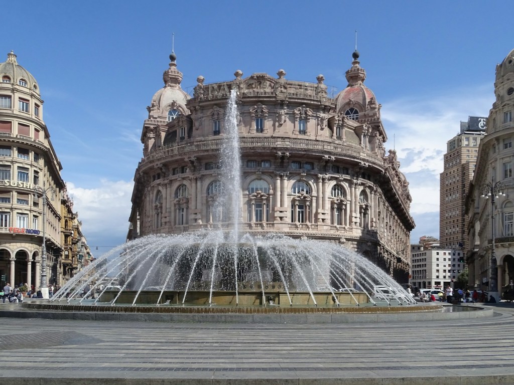 white concrete building with water fountain during daytime