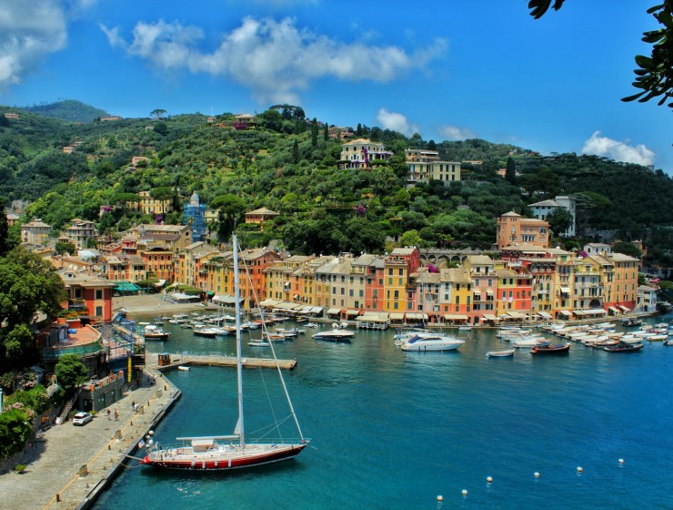 white boat on body of water near Portofino city buildings during daytime