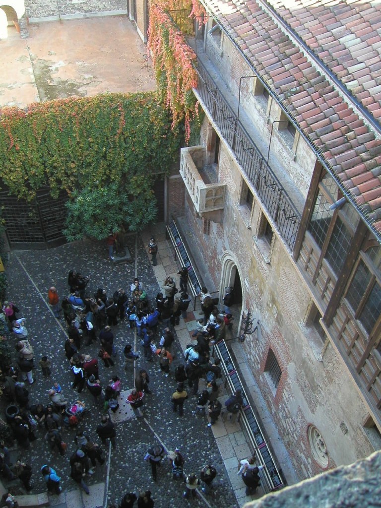 tourists below the Juliet balcony in Verona