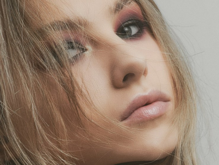 a close up of a woman with long hair