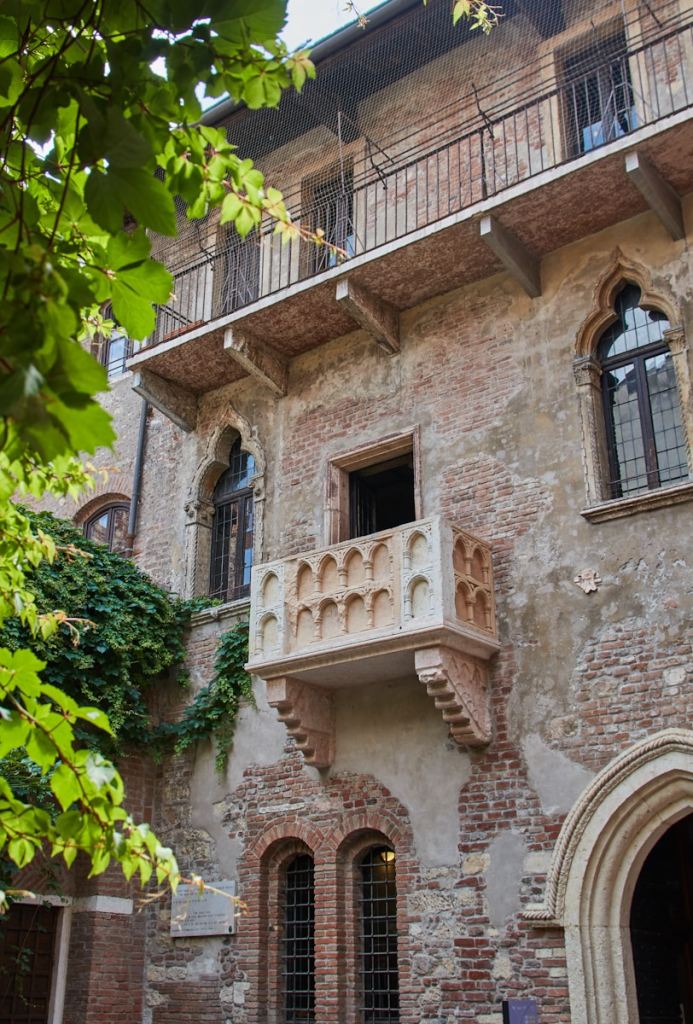 brown brick building with green plants