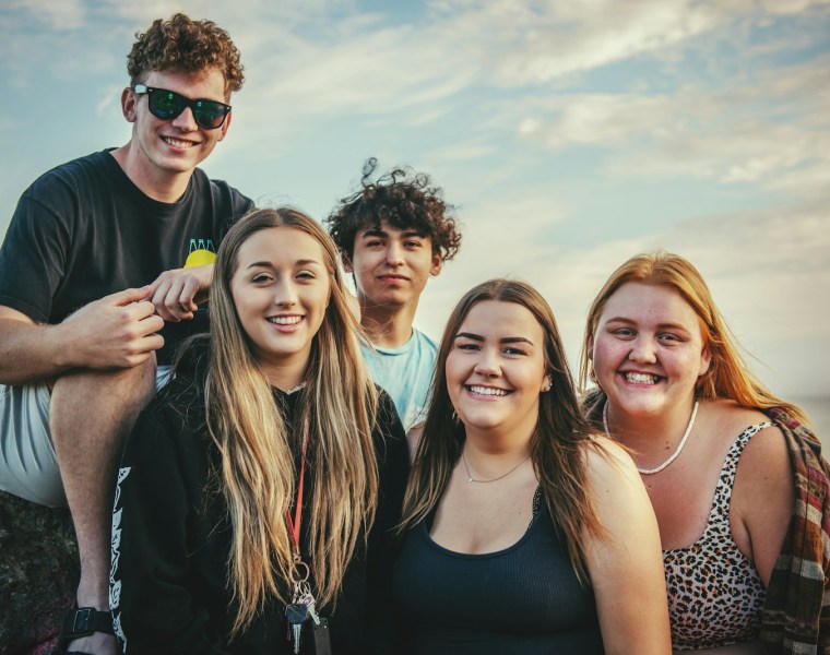 photography of five people near outdoor during daytime