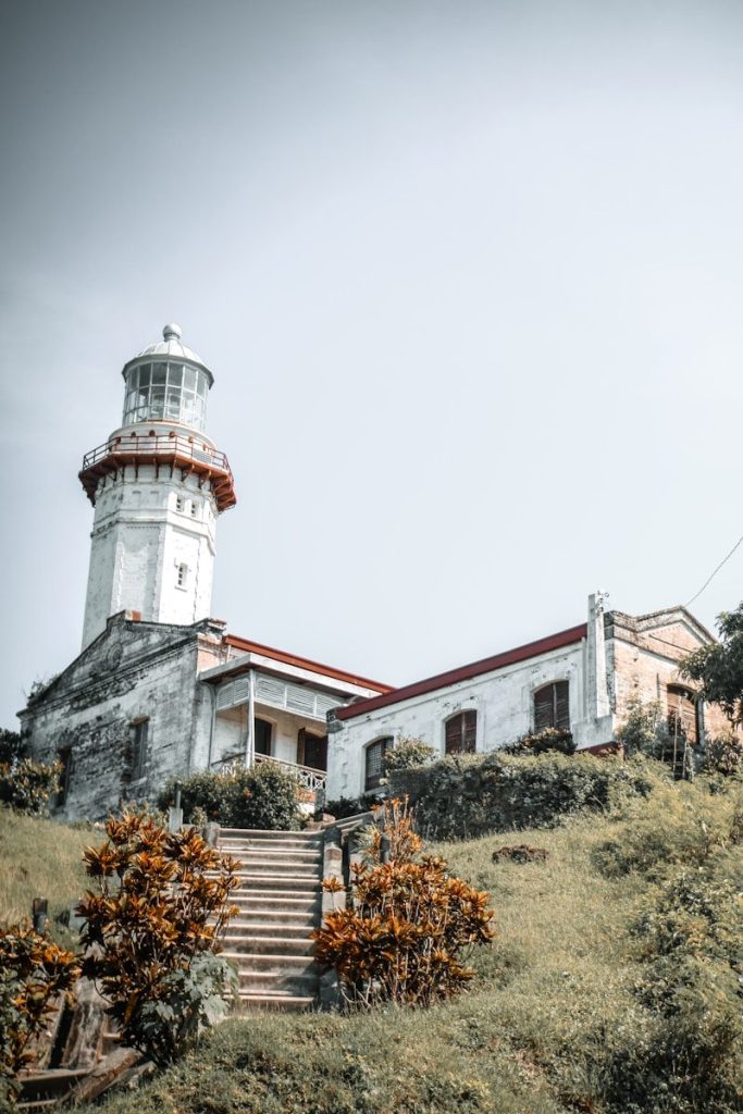 white concrete castle, Cape Bojeador Lighthouse in Burgos