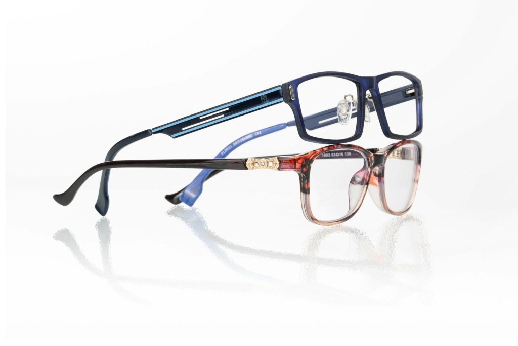 A pair of glasses sitting on top of each other