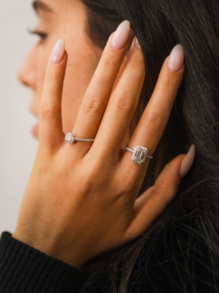 Woman's hand with two diamond rings
