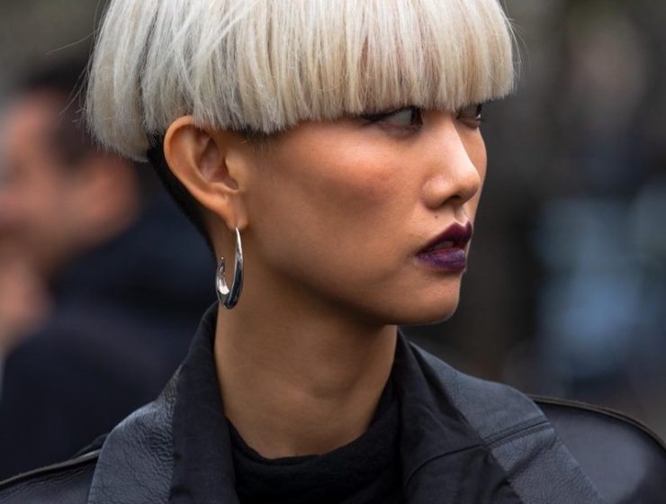 selective focus photography of woman wearing hoop earring