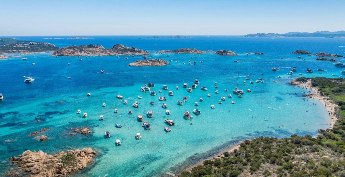 Sardinia - people swimming on beach during daytime