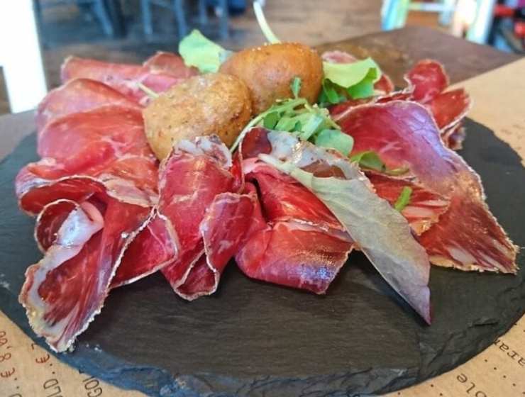 a plate of bresaola, cured Italian beef