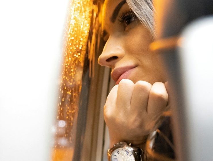woman looking at window