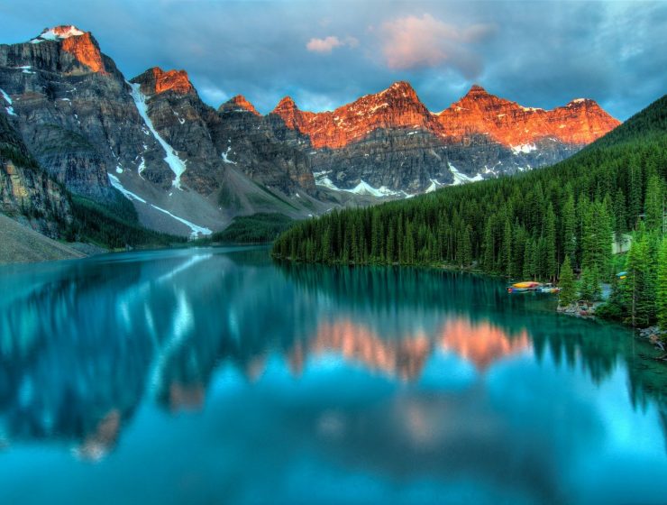 Moraine Lake Canadian Rockies reflecting snow-capped peaks in the Canadian Rockies at golden hour
