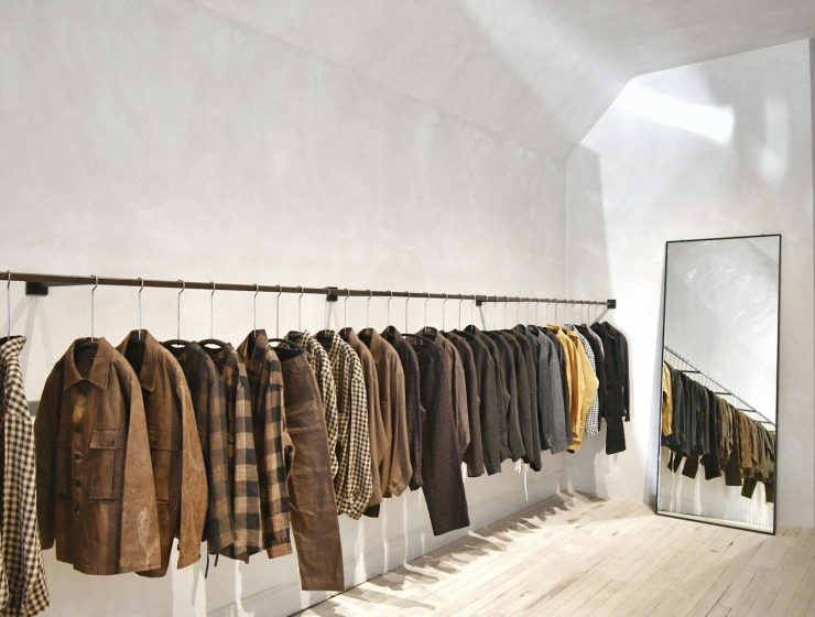 a room with a wall of clothes on the wall